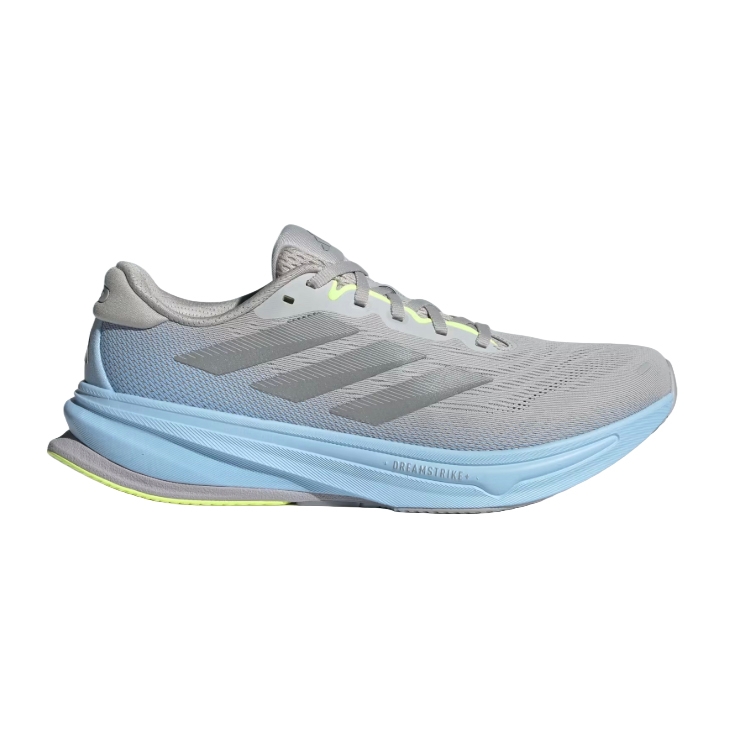Adidas Supernova 2 Shoes are light gray with a light blue midsole, featuring three gray stripes on the sides. They have a streamlined design with \“DREAMSTRIKE+\“ on the sole and a neon green accent on the outsole.