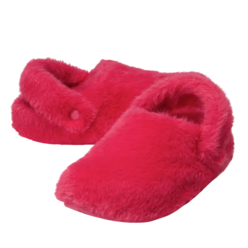 Bright pink fuzzy slippers with a cozy design, featuring a fold-over detail on one slipper.