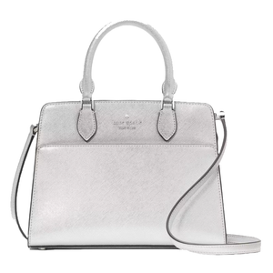 A silver Kate Spade New York small satchel featuring dual handles, a detachable shoulder strap, and a structured silhouette. The bag has a subtle, textured finish with the brand's logo stamped on the front.