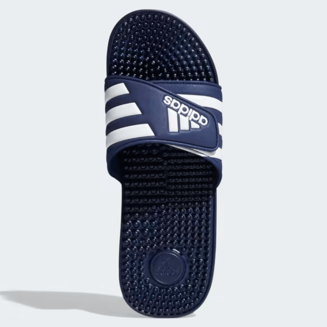 A single dark blue and white slide sandal with a textured footbed and three stripes on the strap.
