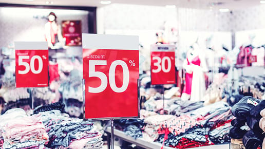 sale signs in clothing store