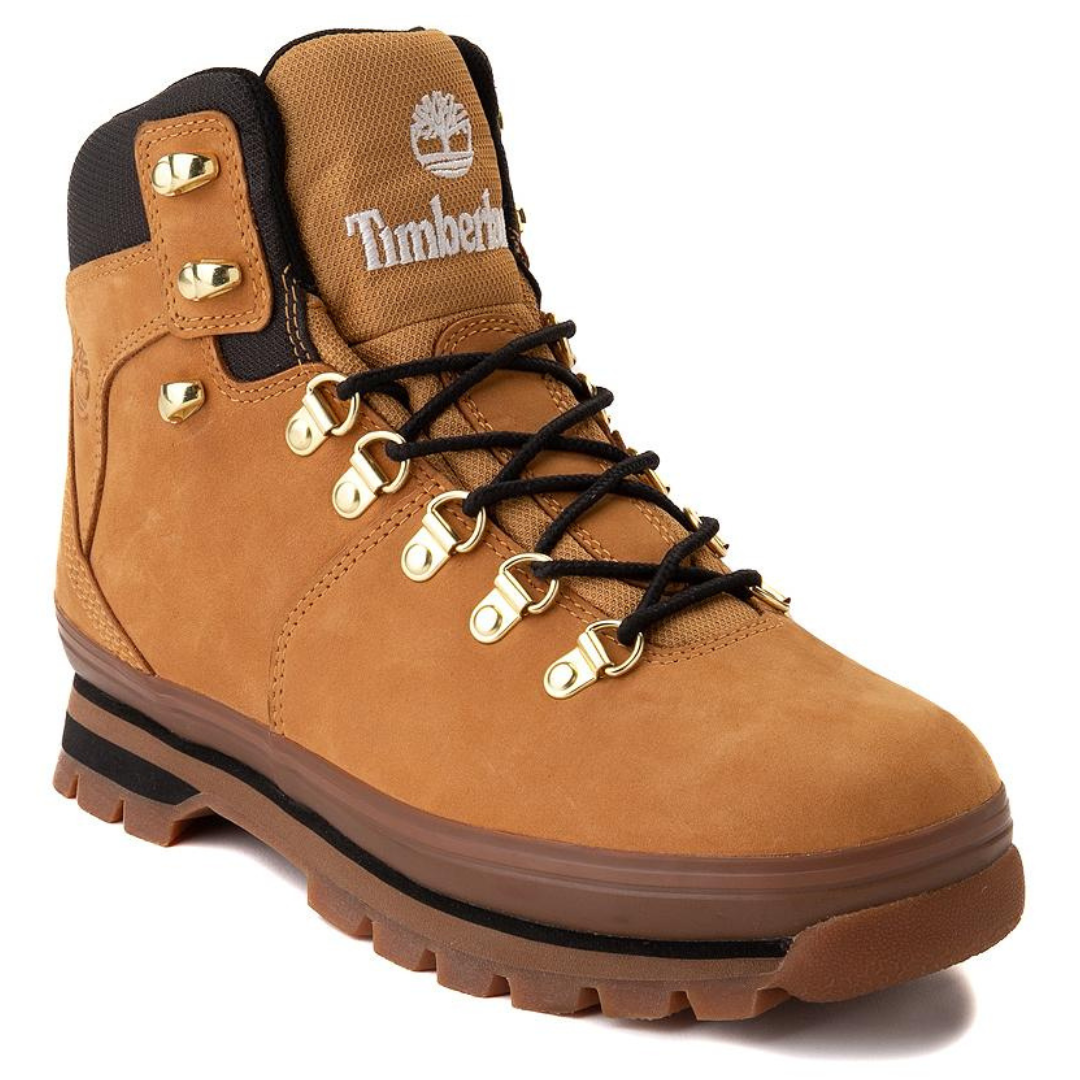A tan-colored work boot with a high-top design, metal eyelets, and a prominent logo embroidered on the side.