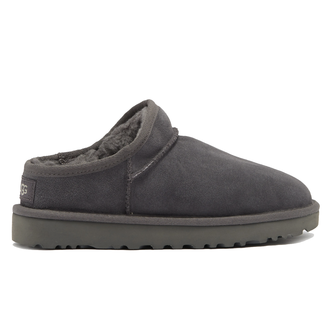 A dark gray slipper with a thick sole and plush interior lining, featuring a low-cut back for easy slip-on wear.