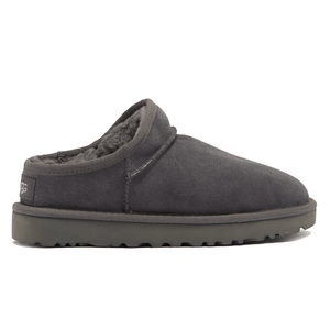 A dark gray slipper with a thick sole and plush interior lining, featuring a low-cut back for easy slip-on wear.