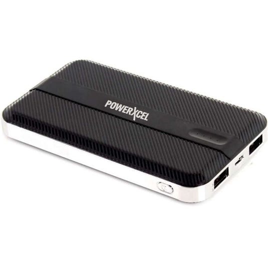 A black PowerXcel portable power bank with two USB ports and an indicator light.
