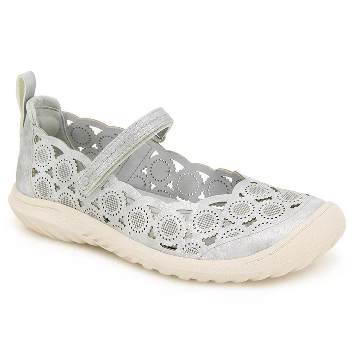 A light gray Mary Jane shoe with a scalloped edge and circular cutout design, featuring a strap across the top and a textured beige sole.