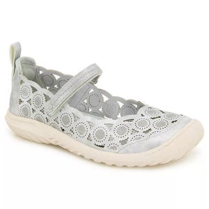 A light gray Mary Jane shoe with a scalloped edge and circular cutout design, featuring a strap across the top and a textured beige sole.