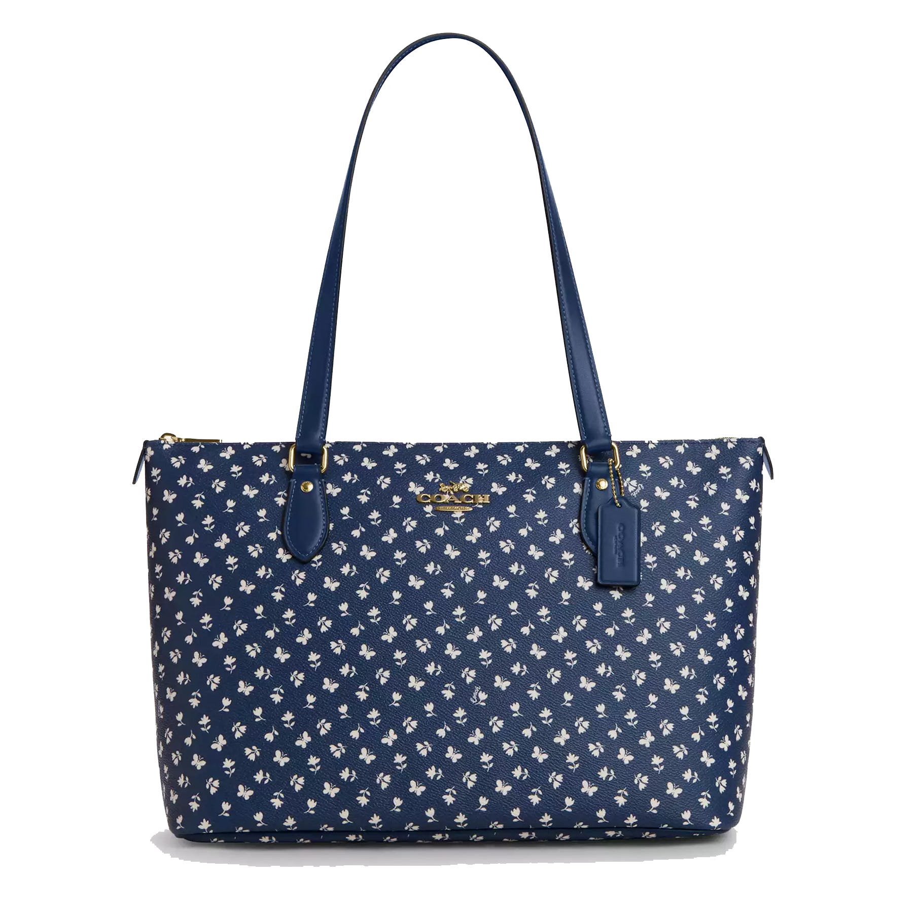 Blue Coach tote with white floral pattern, gold logo, and dual handles.