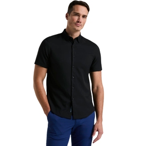 A slim fit, short-sleeve black shirt with a button-up front, featuring a collar and made from a stretchy fabric, paired with blue pants for a sleek, modern look.