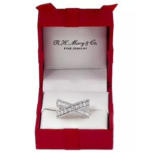 A 3/4ct Effy diamond ring featuring a bow design with encrusted diamonds, set in a bright silver-toned band inside a red and white jewelry box marked with \“Fine Jewelry.\“