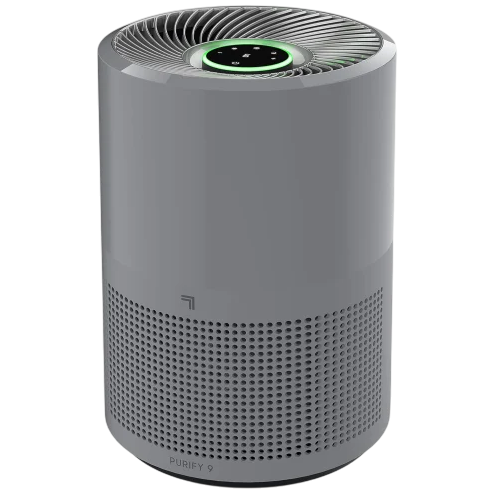 A cylindrical air purifier with a sleek design, featuring a top vent and circular control panel with a green light indicator.