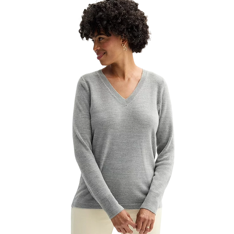 A woman wears a gray Croft & Barrow Extra Soft V-Neck Sweater, showcasing a classic design with long sleeves and a comfortable fit.
