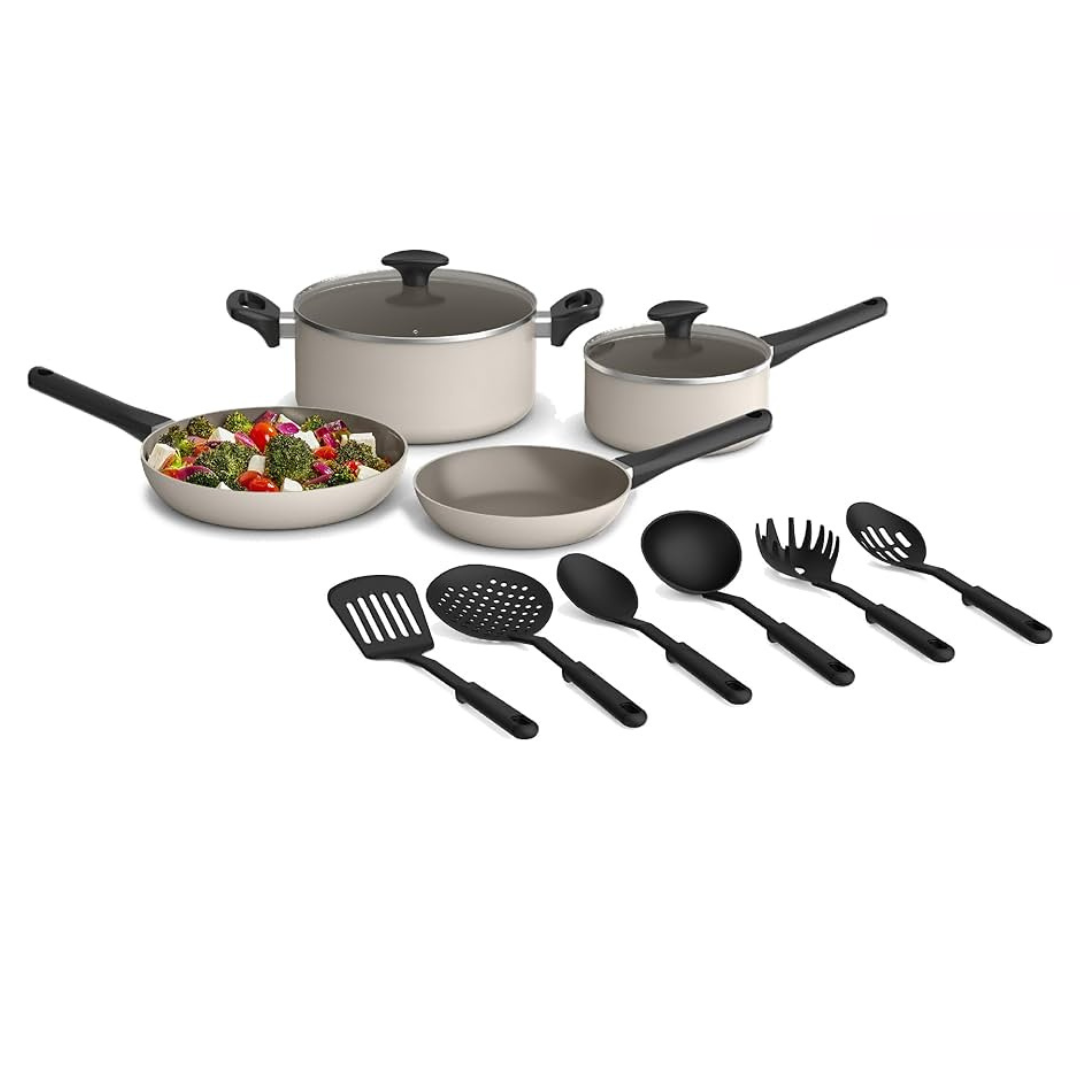 12pc Bella Cookware Set includes two pots with lids, two frying pans, a deep sauté pan, and five black utensils—a spatula, slotted spatula, slotted spoon, solid spoon, and spaghetti server. The cookware has a beige exterior with black handles.