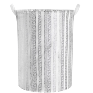 A cylindrical fabric storage basket with vertical stripes pattern and two handles.