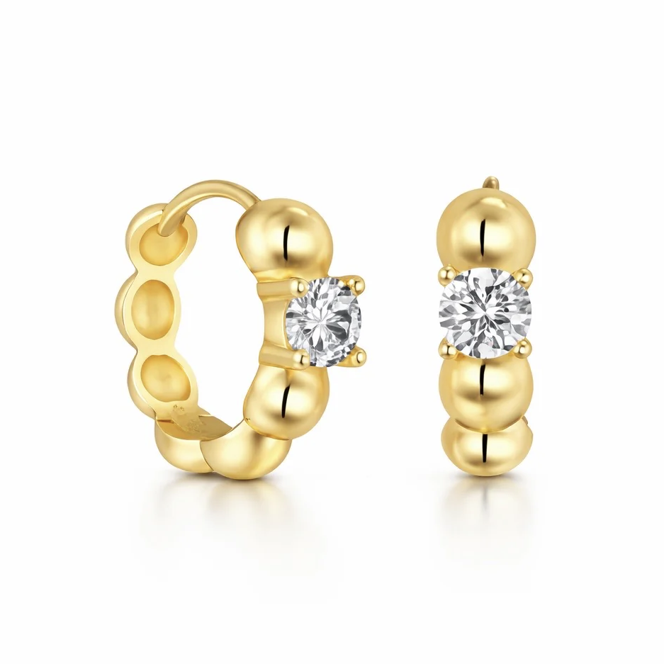 Gold hoop earrings with a beaded design, featuring round, clear gemstones set at the center.