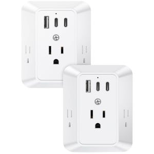 Two white wall outlets with USB and USB-C ports for charging electronic devices.