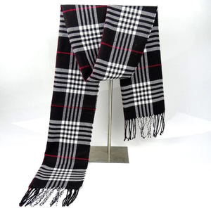 A black cashmere-blend scarf featuring a plaid pattern with white and red accents, measuring 72 inches long. The scarf has fringed ends for added style.