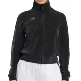 A black zip-up jacket with a high collar and an Adidas logo on the chest, paired with white pants.