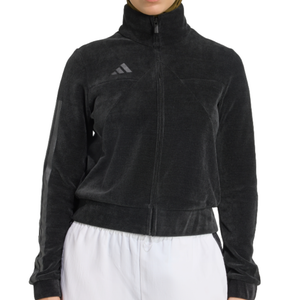 A black zip-up jacket with a high collar and an Adidas logo on the chest, paired with white pants.
