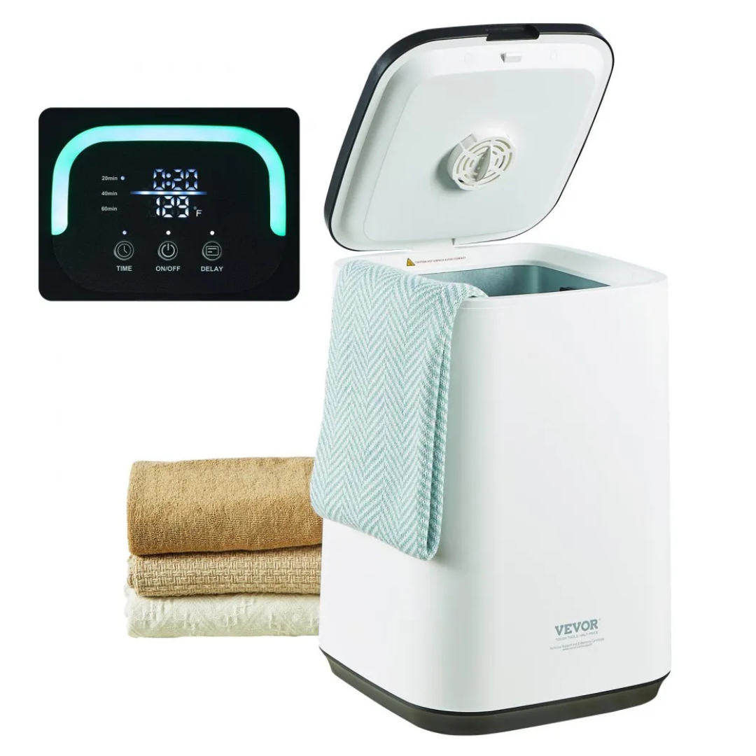 A towel warmer with an open lid is shown alongside several folded towels and a digital control panel displaying temperature and timer settings.