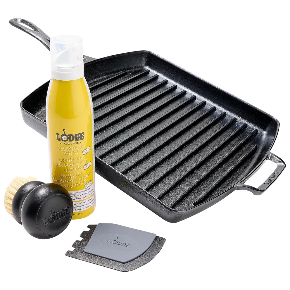 Cast iron grill pan with ridges, seasoning spray, a cleaning brush, and a scraper tool, all branded with \“Lodge.\“