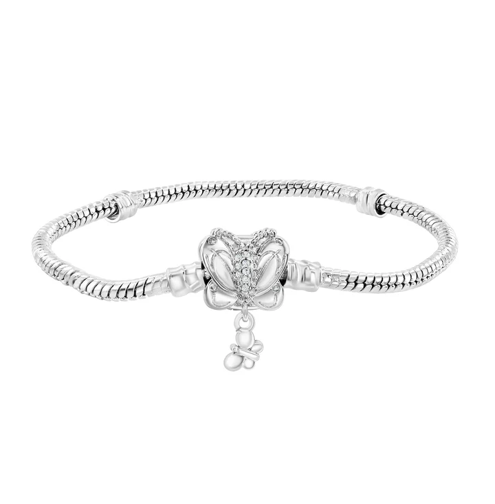 A silver bracelet features a butterfly charm adorned with small gemstones and a dangling element, attached to a sleek, snake chain design.