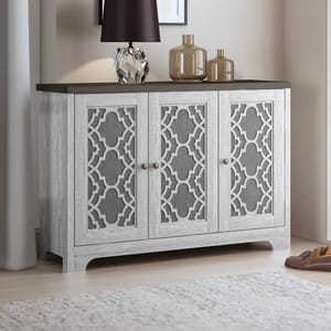 The 16-Pair Shoe Storage Cabinet features a light wood finish with decorative lattice-patterned doors, and has a flat top adorned with two vases and a lamp.
