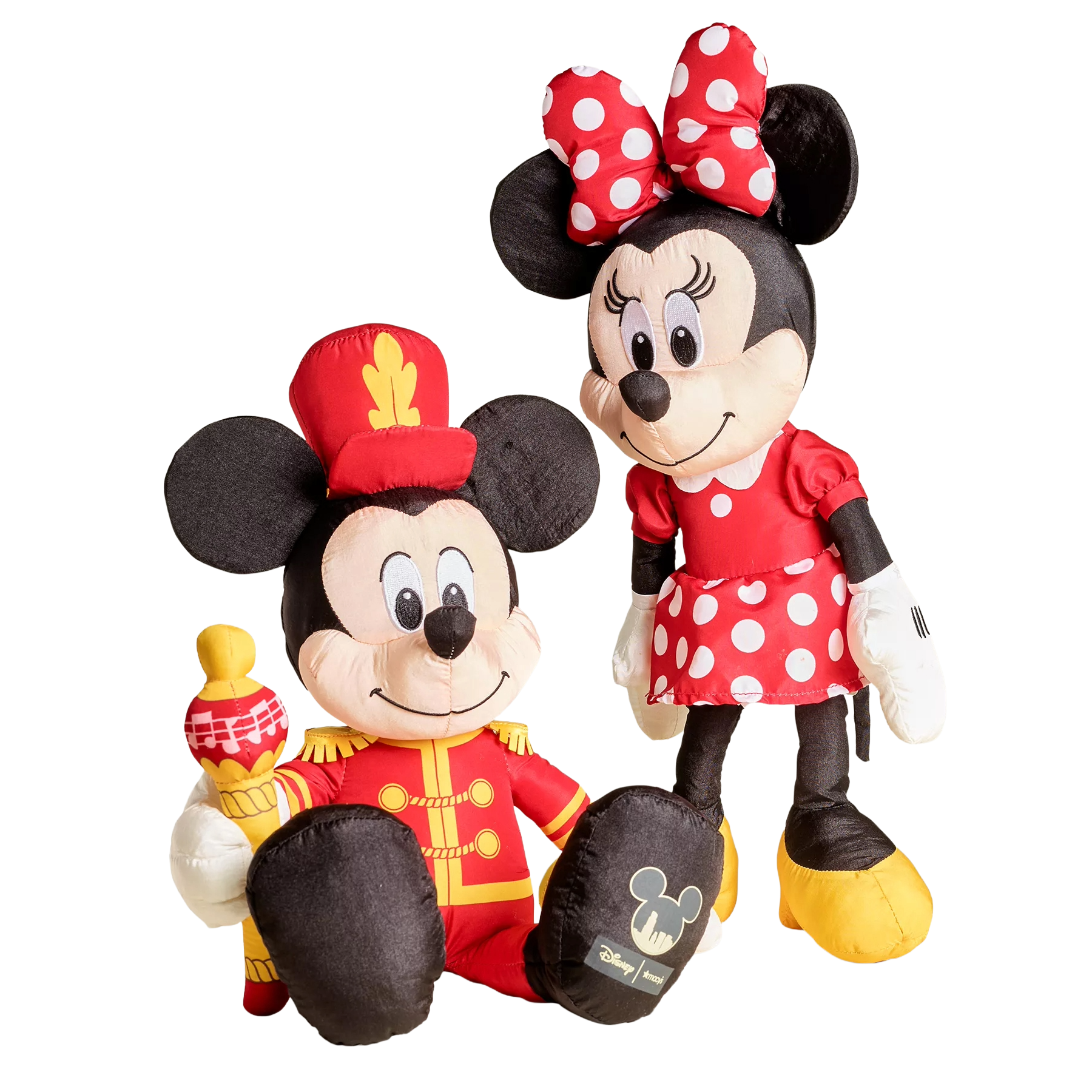 Plush toys of two iconic cartoon mice, one in a band leader outfit holding a baton, and the other in a red dress with white polka dots and a bow.