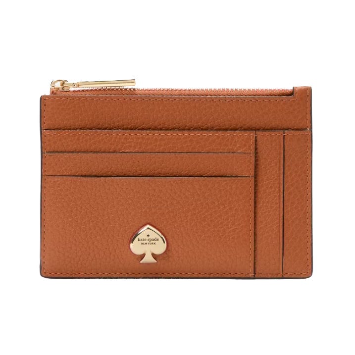 A brown leather cardholder with multiple slots and a gold zipper, featuring a spade-shaped logo that reads \“kate spade new york.\“