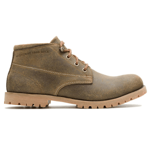A rugged brown leather chukka boot with a textured sole and three eyelets for lacing, featuring \“Wolverine 1000 Mile\“ embossing on the side.