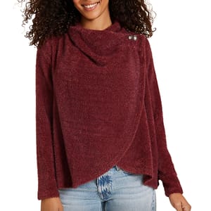 A long-sleeve, deep red asymmetrical cardigan with a draped neckline and overlapping front design, featuring button accents on the shoulder, paired with light blue jeans.