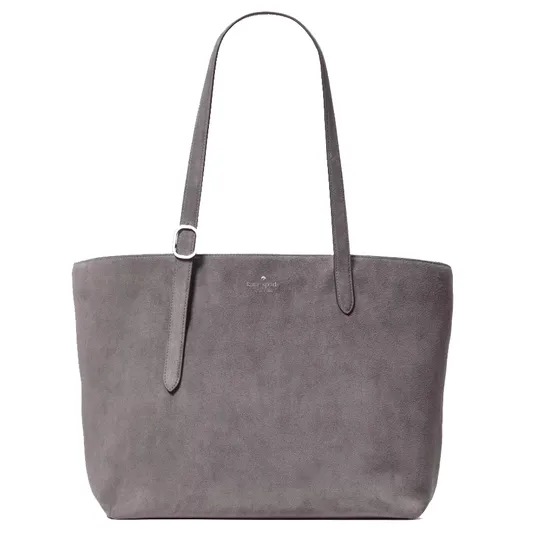 A gray suede tote bag with adjustable shoulder straps and a subtle embossed logo at the top center.