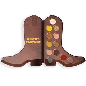 The Toy Story Eyeshadow Palette is shaped like cowboy boots and includes 12 shades with a mix of matte and shimmer finishes. The palette says \“Howdy, Partner!\“ in yellow text on the left side.