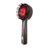 A handheld pet grooming brush with a built-in red light feature, designed for easy detangling and possibly therapeutic benefits.