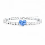 A bracelet featuring a line of clear stones and a central heart-shaped blue gemstone with a lobster clasp closure.
