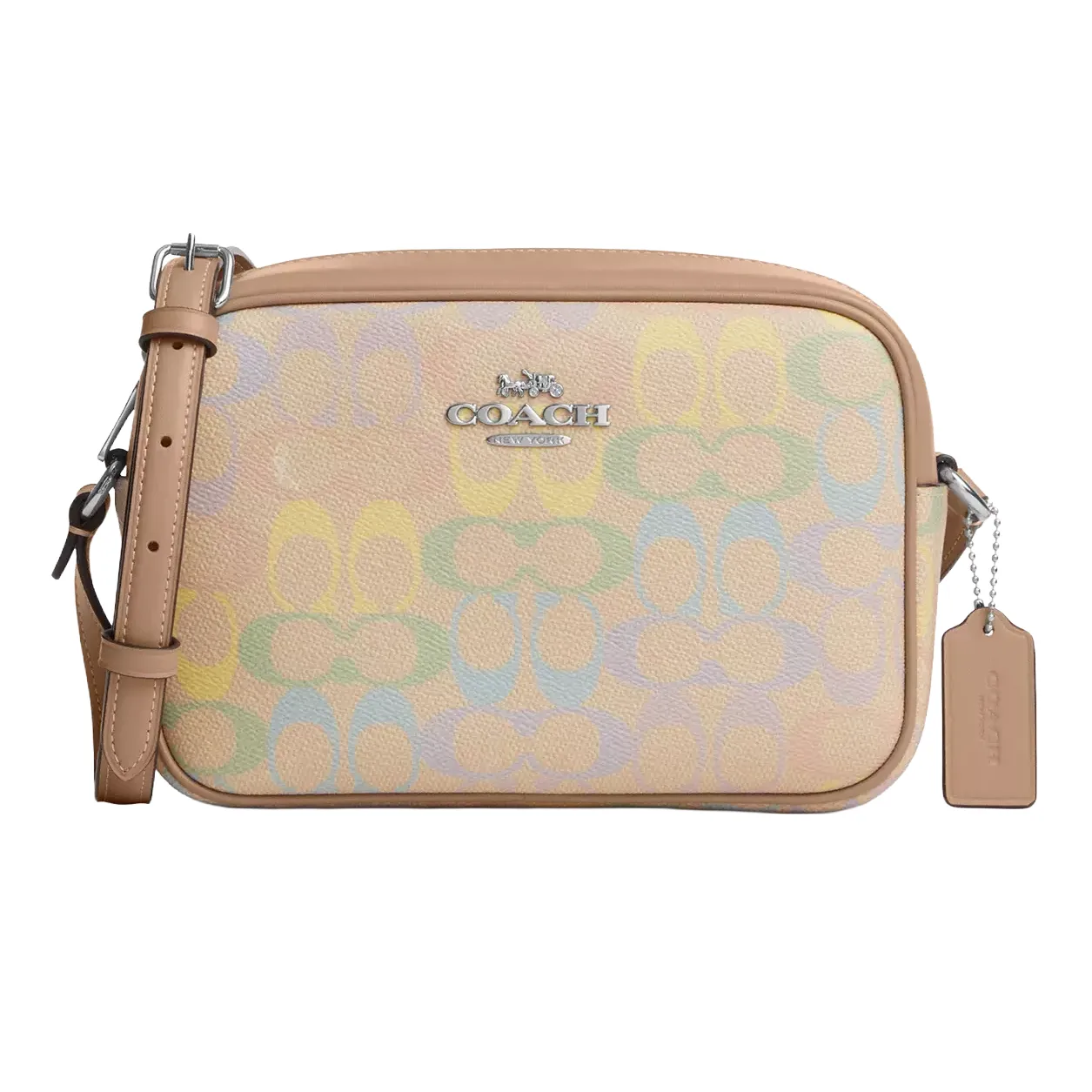A Coach crossbody bag with a light tan strap, featuring a pastel multi-color signature pattern and a silver logo.