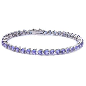 Silver bracelet with purple heart-shaped gemstones and a clasp closure.