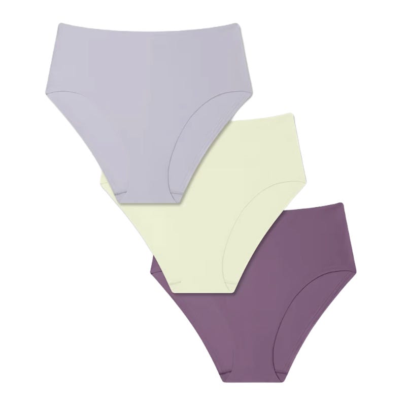 A set of three high-waisted women's underwear in pastel colors: light purple, pale yellow, and mauve.