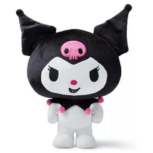A plush toy of Kuromi, a character from Sanrio, featuring a black jester hat with pink accents, a pink skull on its forehead, and a mischievous expression.