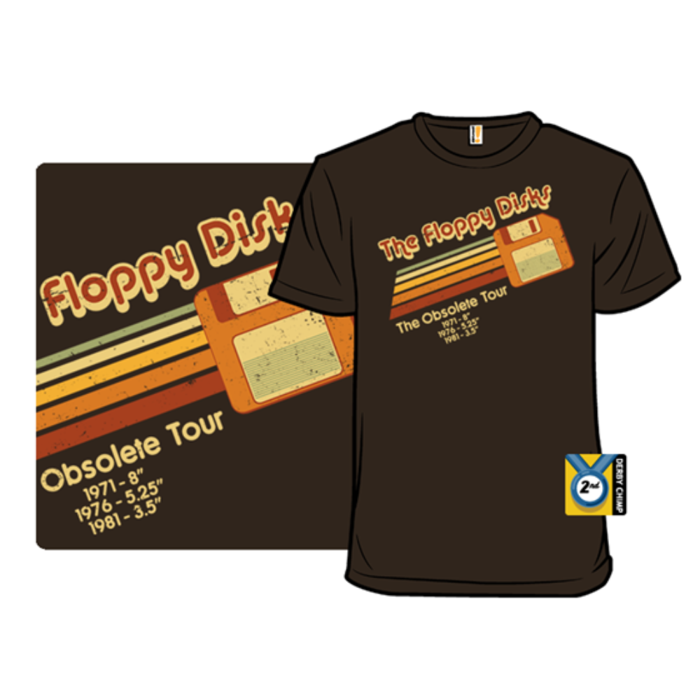 A brown T-shirt features a retro design with an image of a floppy disk and text reading \“The Floppy Disks\“ and \“The Obsolete Tour\“ with sizes and years: \“1971 - 8”\“, \“1976 - 5.25”\“, and \“1981 - 3.5”\“.