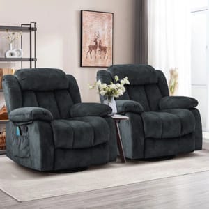 Two plush, dark gray recliners with padded armrests and a side pocket, placed in a living room setting with a small table between them and a deer artwork above.