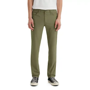 Levi's 511 Slim Tech Pants in olive color feature a slim fit design with a classic 5-pocket style, belt loops, and a button-zip closure, paired with black and white sneakers.