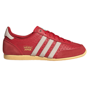 Red Adidas Japan sneakers with white stripes and a beige sole, featuring the text \“adidas JAPAN\“ in gold on the side.