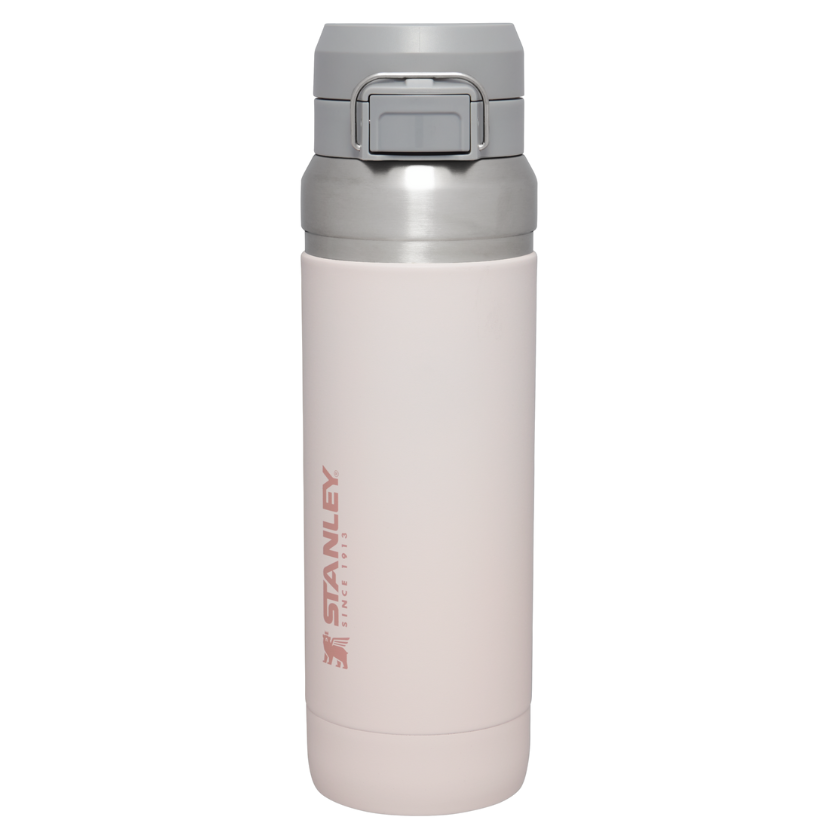 Stanley 36 oz Quick Flip Go Bottle, light gray with a secure flip-top lid, designed for easy one-handed use.