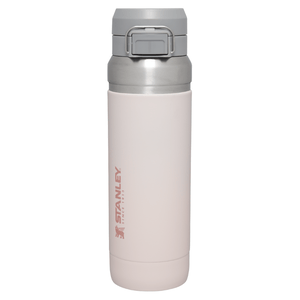 Stanley 36 oz Quick Flip Go Bottle, light gray with a secure flip-top lid, designed for easy one-handed use.