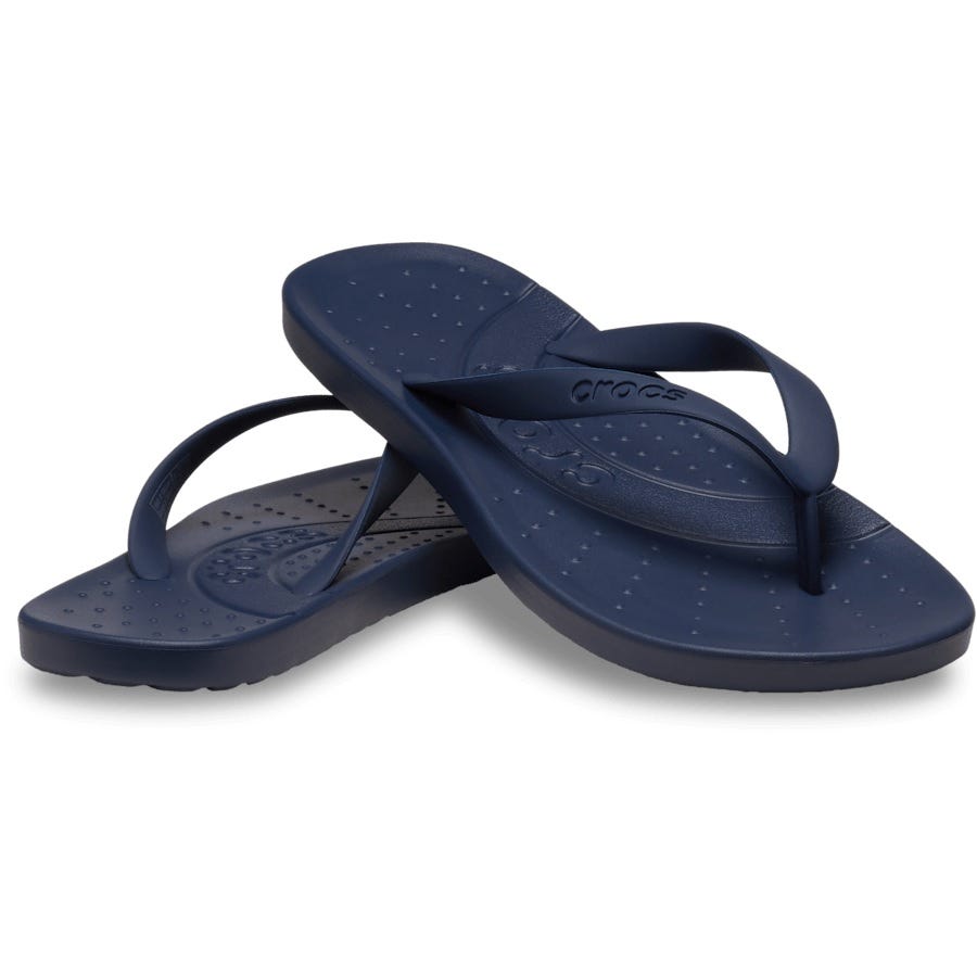 Navy blue flip-flops with a textured footbed and simple strap design, featuring the Crocs logo.