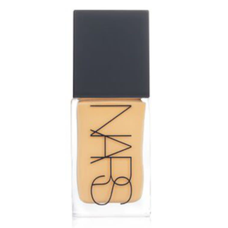 NARS Light-Reflecting Foundation is a liquid foundation housed in a clear bottle with a black cap, featuring the NARS logo. It offers a radiant finish designed to enhance natural skin luminosity.