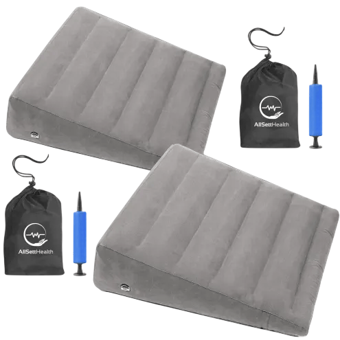 Two inflatable wedge-shaped cushions with air pumps and carrying bags, branded with \“AllSett Health.\“
