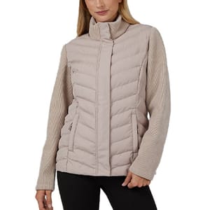 A beige quilted jacket with a high collar, featuring knit sleeves and zippered pockets, worn by a person dressed in black pants.