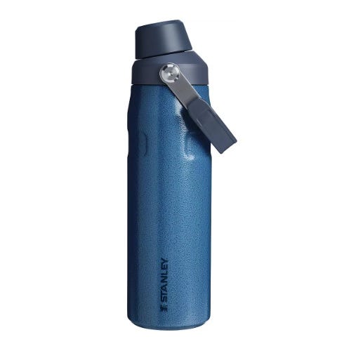 Blue stainless steel water bottle with a flip lid and a carrying handle, branded with \“Stanley.\“